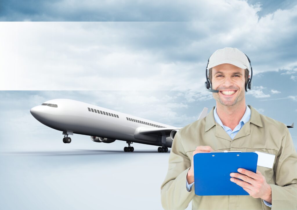 delivery man holding clipboard against airplane in background